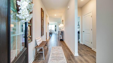 Corridor with hardwood / wood-style flooring