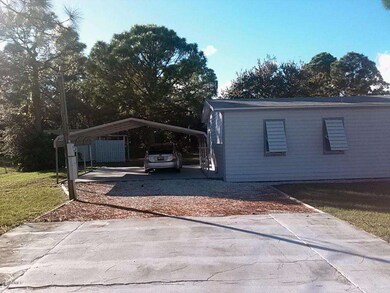 double carport and parking pad by side e