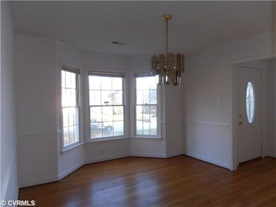 Dining Room - bay window, hardwood floor, chandeli