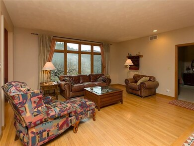 Formal living room with gas fireplace.