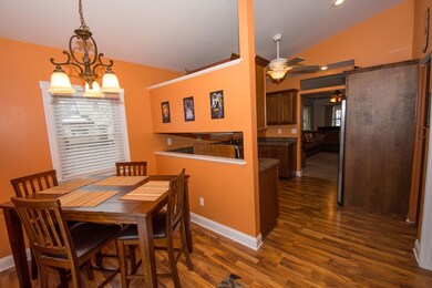 Dining area with view of kitchen.
