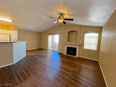 Unfurnished living room featuring dark wood-style