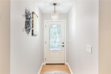Doorway to outside with light wood finished floors