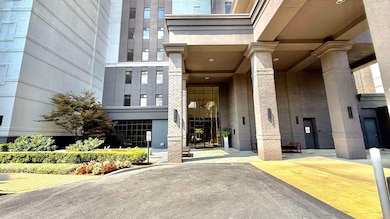 Entrance to property featuring brick siding