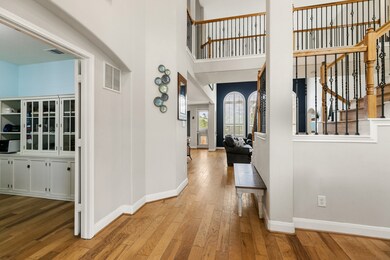 Downstairs, elegant engineered hickory floors brig