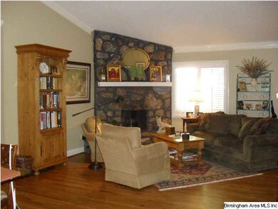 Notice as you enter the Living Room the hardwood f