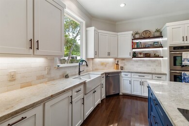 Quartz countertops beautifully compliment the back