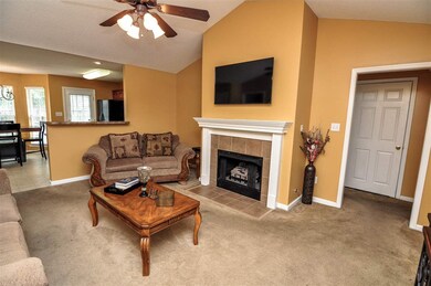 A cozy gas log fireplace highlights the family-siz