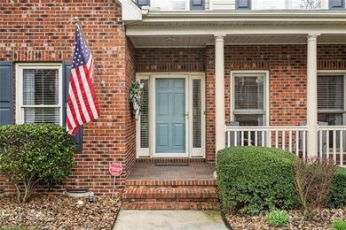 Entry to home has covered front porch with synthet