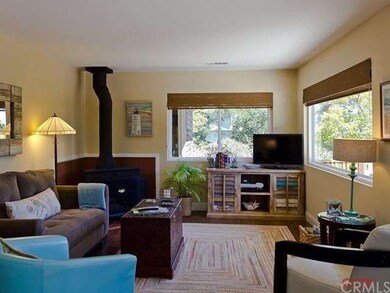 The Living Room features a freestanding wood-burni