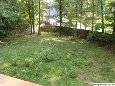 Large shady fenced-in backyard