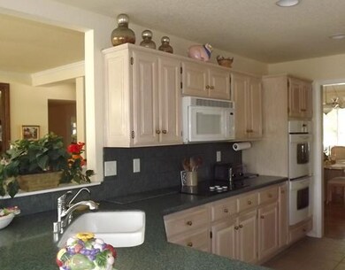 Kitchen. Corian Counter Tops And Plenty Of It !