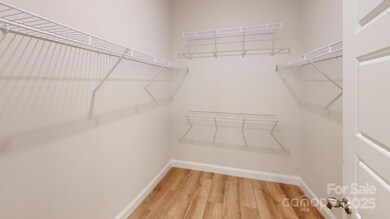 Primary closet - Photo is representative of a previous home built