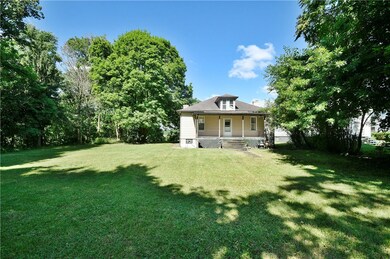 Covered back porch.  Mature landscape, lots of tre
