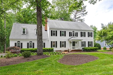Home sits on nearly an acre with lush grass in fro