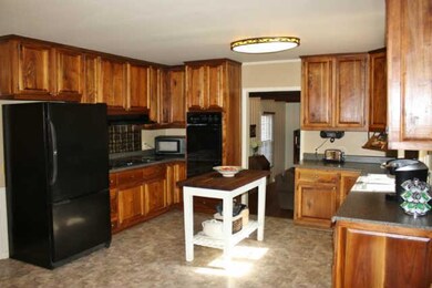 Custom Cabinetry; Cooktop; Opens to the 18x13 sitting room.