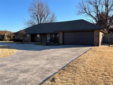 Great curb appeal! Circle drive with stamped and s