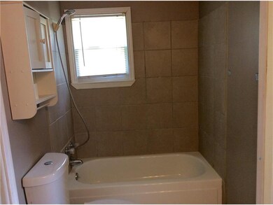 Big bathroom. Shower over tub. Ceramic tile around