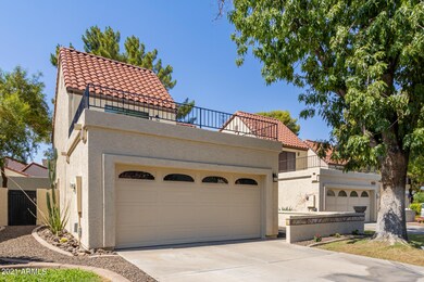 Front of home with above garage deck