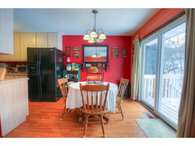 Dining overlooks private backyard, living and kitc