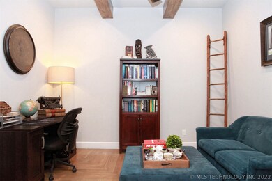 Office features wood beamed ceiling and hardwood f