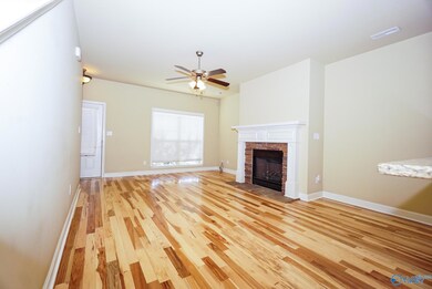 Brand new gorgeous real hardwood floors with gas fireplace. Open to kitchen bar, dining area and covered back porch for easy entertaining and relaxing. Surround sound speaker hookups pre-wired.