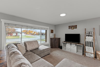 Living area featuring carpet flooring