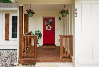 Property entrance with board and batten siding