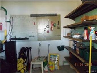 Exterior storage room accessible from carport.