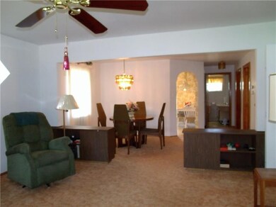 Open living room and dining room area.