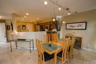 Dining room with contemporary light fixture- kitch