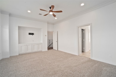 VERY spacious primary bedroom with built-in cabinets ready for your state of the art entertainment center