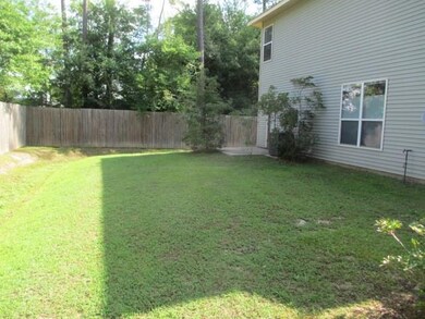 Large side yard, along with rear yard, all partially fenced