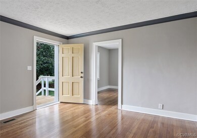 Living room view to the front entrance to the home