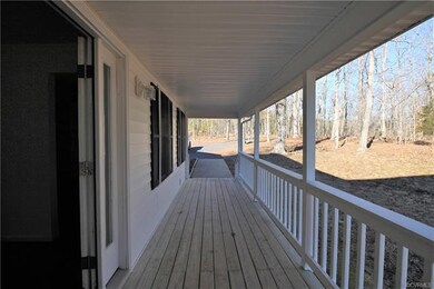 A covered front porch greets you and is ready for 
