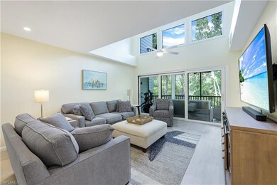 Bright and airy great room with loft above.