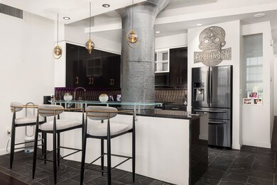 Kitchen with decorative backsplash, appliances wit