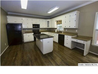 Kitchen with gorgeous countertops, all black appli