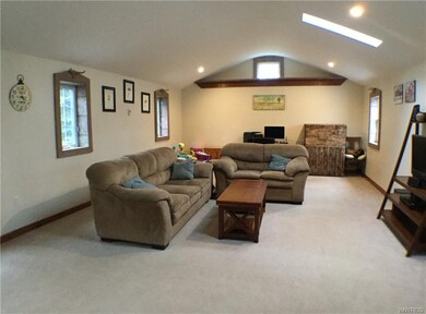 Living Room with vaulted ceilings and skylights