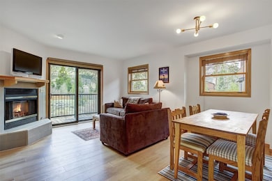 Living area with a fireplace, light wood finished