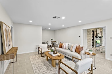 Living room featuring light tile patterned floors
