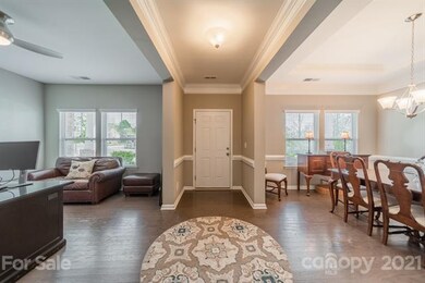 Living room/office and dining room flank the entry