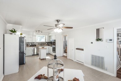 To the left upon entering the front door, is this very large kitchen. Excellent for those large holiday dinners.  This kitchen easily holds a large formal dining set, display hutch, sideboard, etc. .