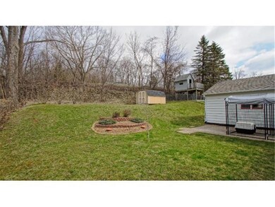 Backyard.  Cement patio next to the garage.  You c