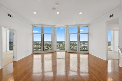Spare room featuring ornamental molding, hardwood 