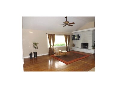 Large Open Vaulted Ceilings in the Living Room with great Daylight and a Fireplace.
