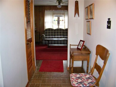 Foyer provides access to living, dining and family