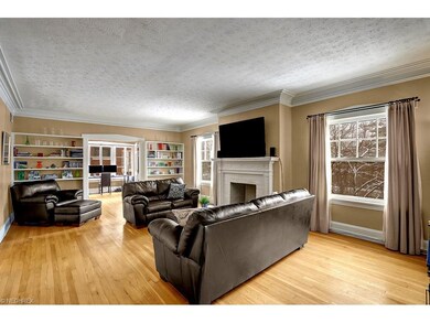Warm and cozy living room has hardwood floors, dec