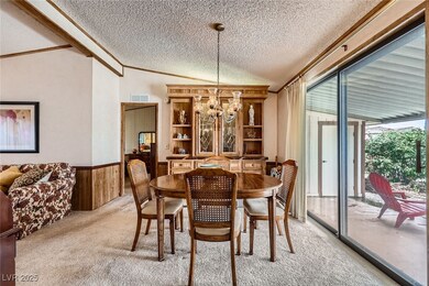 Dining space featuring light colored carpet, a tex
