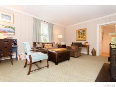 Inviting Library w/carpet over hardwood, fireplace